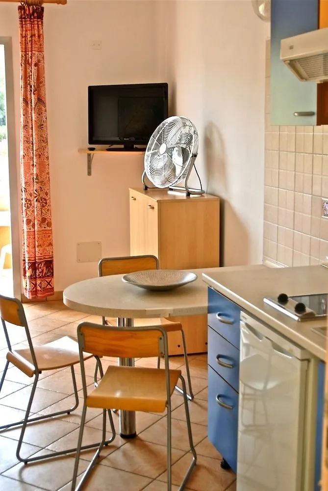 **** Aparthotel Residence Reale Porto Azzurro Italië